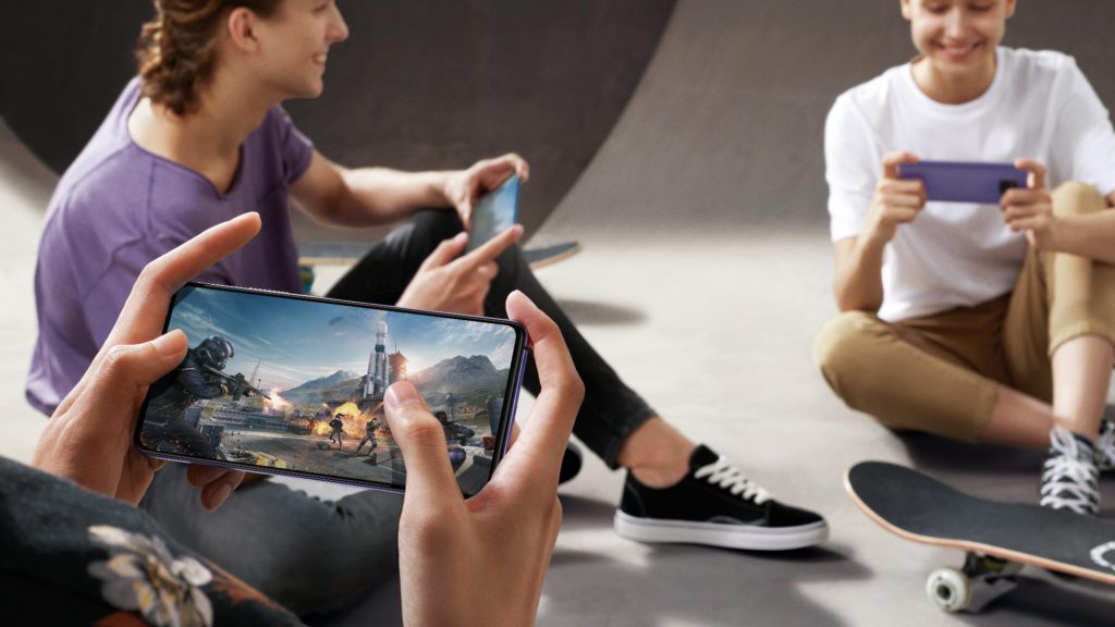 youths playing games on their Huawei mobile phones for a commercial advertisement