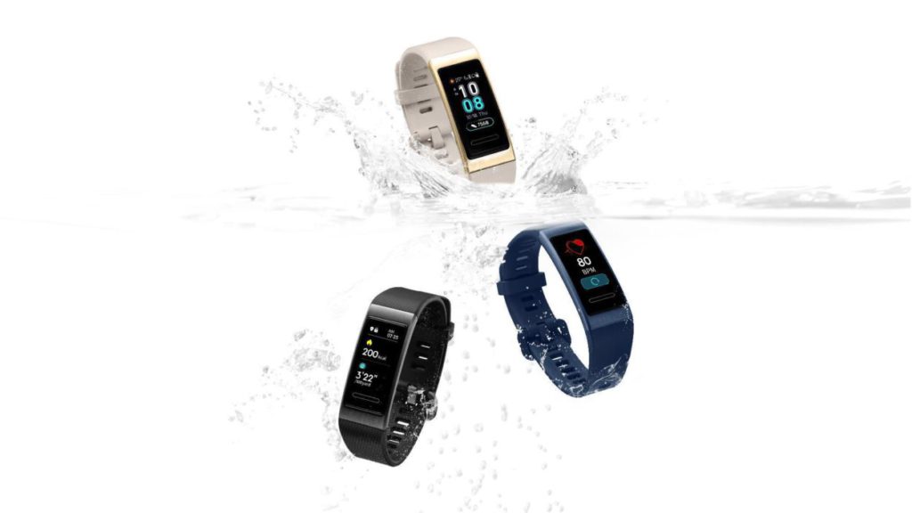 advertisement by commercial photographers showing three Huawei wearables submerged in water