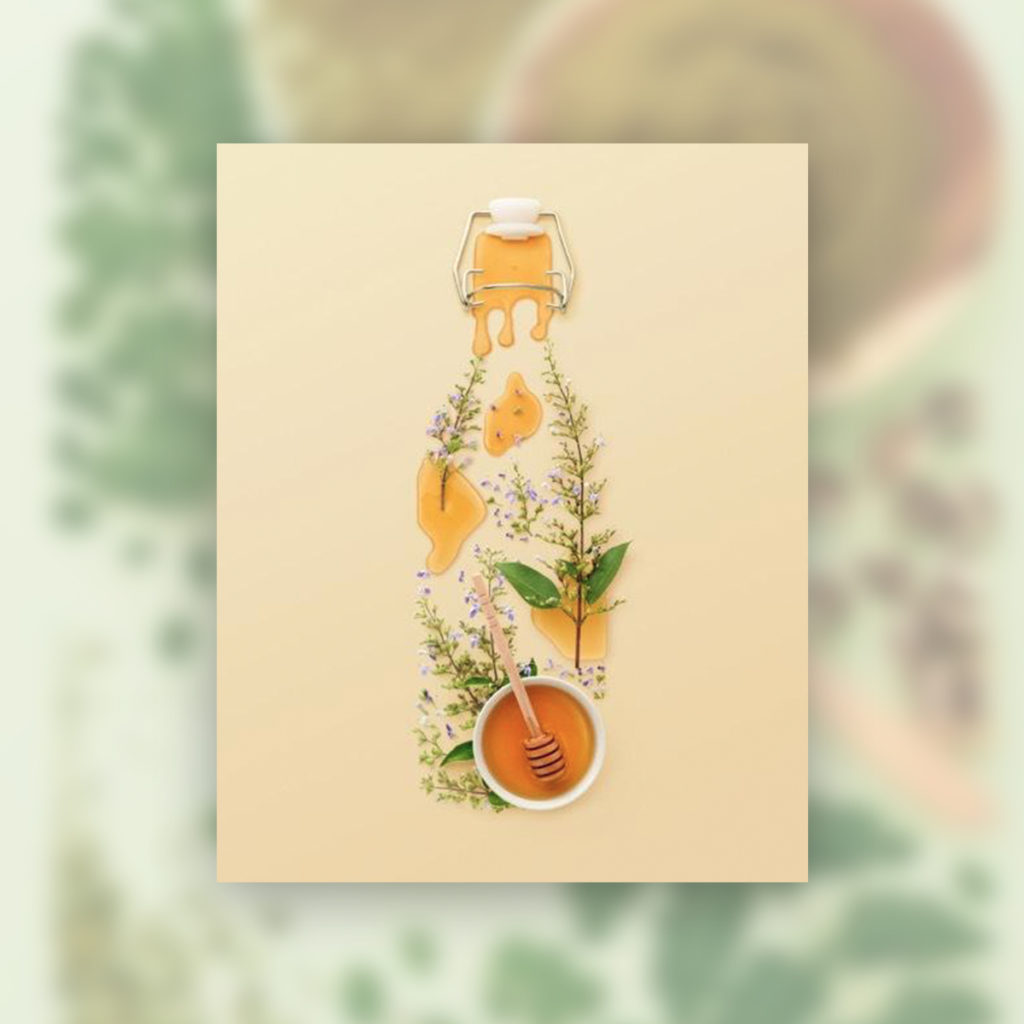 herbs and honey on a flat lay to resemble the shape of a bottled drink for a concept commercial photograph